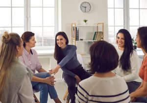 women are able to open up about their struggles and support each other in a women's rehab group therapy session