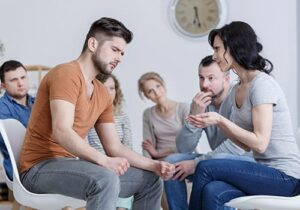 individuals do anger management exercises in group therapy