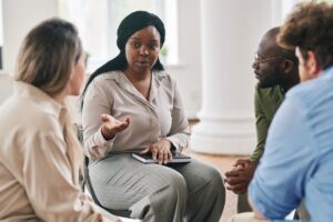 a woman benefits from cbt in a group therapy setting