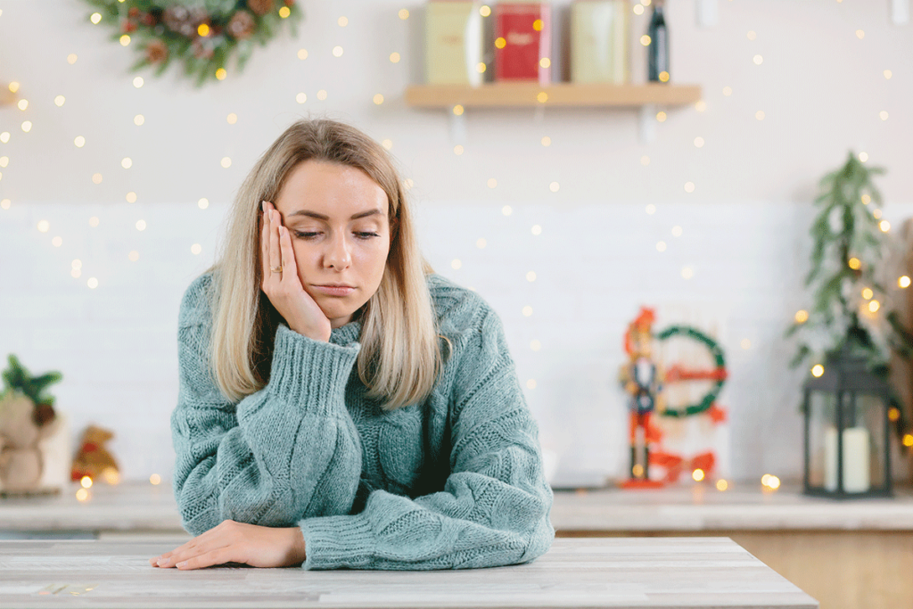 a young woman struggles with managing holiday stress