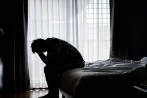 a man struggles with post acute alcohol withdrawal symptoms