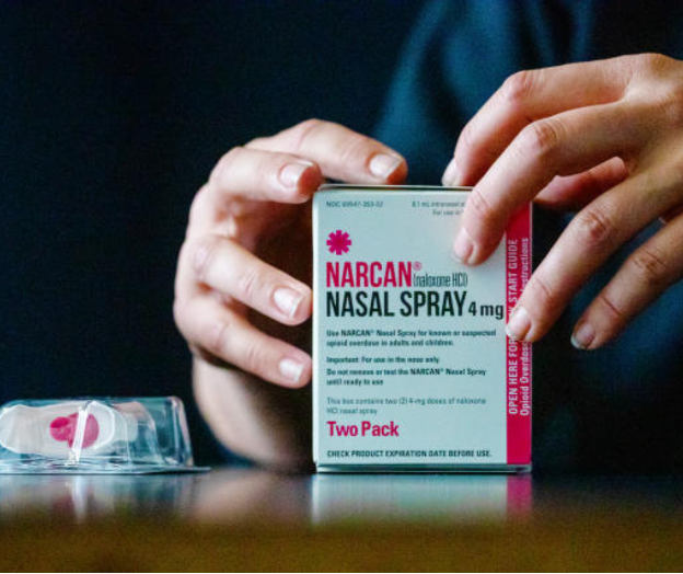 a provider opens a box of narcan