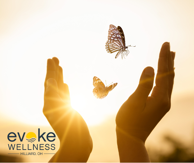 hands release two butterflies